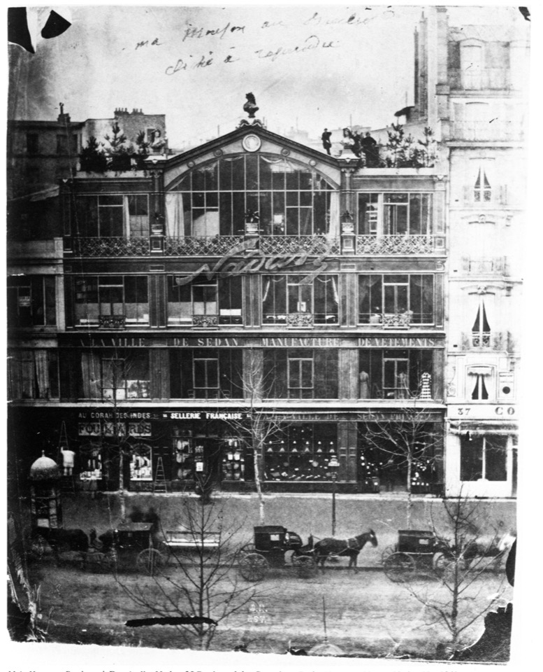 Nadar’s glass-fronted photography studio above a Paris boulevard, with his name across the facade.